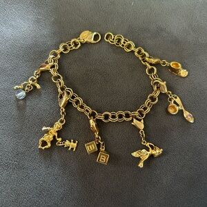 Gold Kirk’s folly charm bracelet